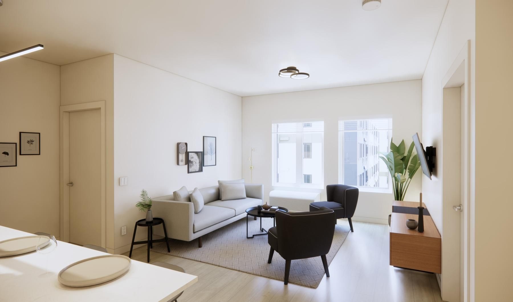 a room with a couch and chairs